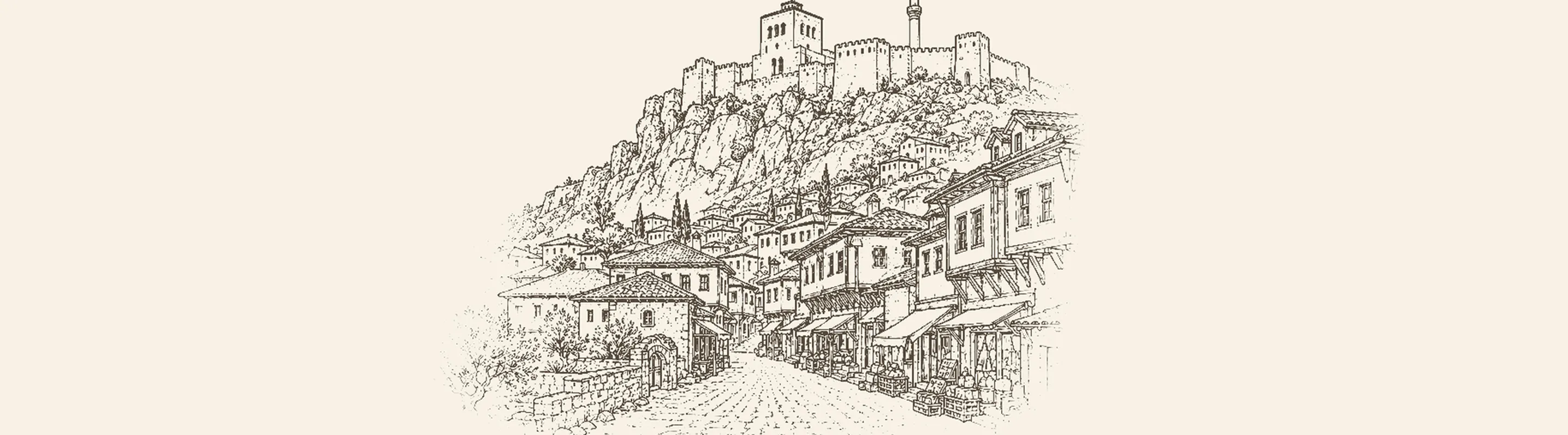 Kruja'nın sarp yamacındaki kalesi ve altındaki eski çarşı