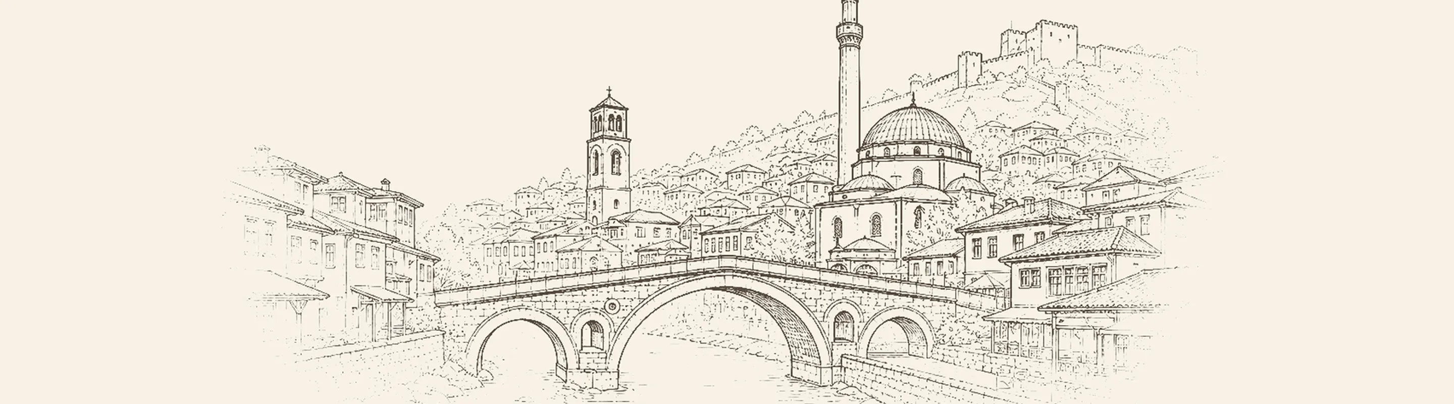 Prizren'in taş köprüsü, cami kubbeleri ve tepedeki kalesi